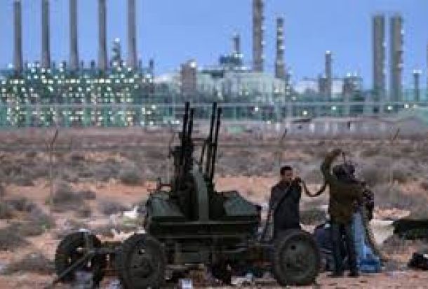 من هو السجين السابق في غوانتانامو الذي يعمل مستشار لدى المؤسسة الوطنية للنفط ؟